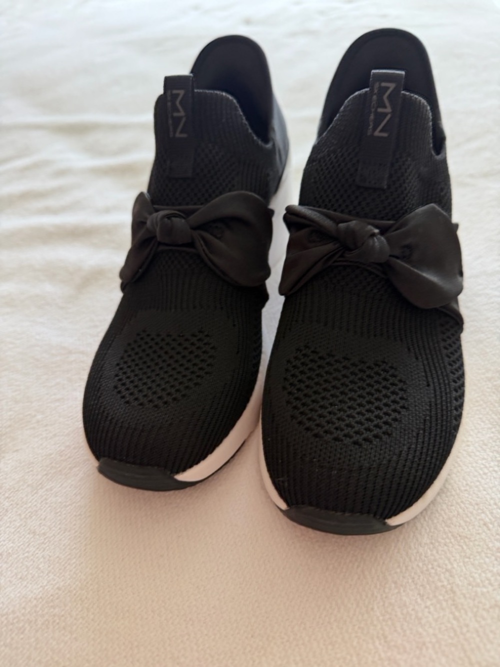 Women's Black Skethers Knit Slip-On Sneakers with Bow Accent